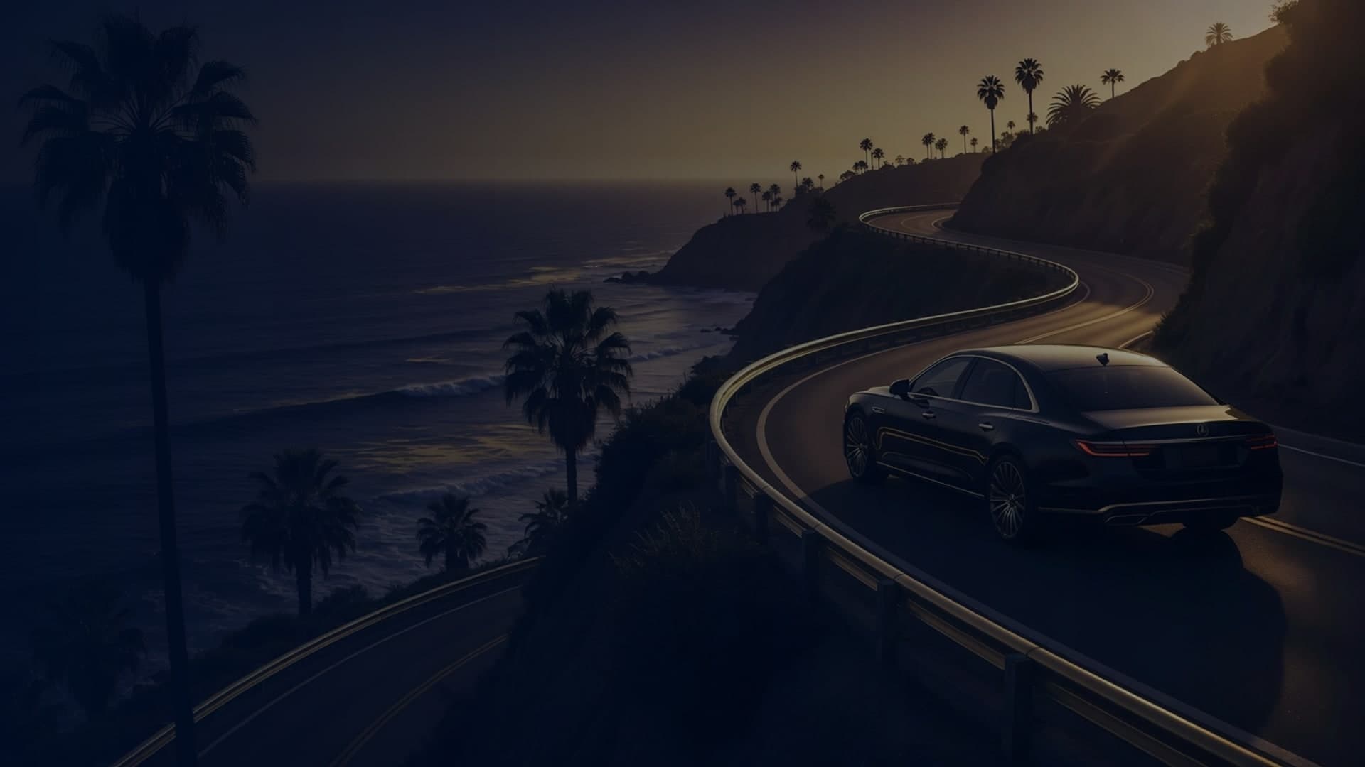 Row of luxury vehicles at a California dealership at dusk